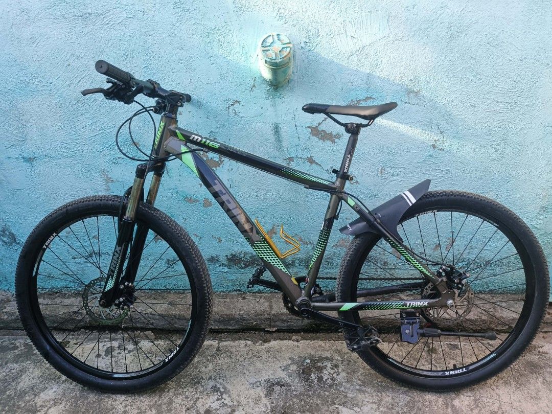 Trinx MTB M116 26er (Category: Bicycles) located in Manila. Submitted by janusalzo22136 (Listing ID 1452744693, Image 2). Description: Trinx M116 MTB 26er - 1x7 Speed - Alloy Frame - Mechanical Disc Brakes - Bottle Cage - Fenders - Kenda Tires Issues Konting bounce nalang yung shock Gulong pudpod na Price 3500 Negotiable Loc Binan Laguna.