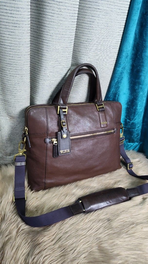 Tumi Beacon Hill branch (Category: Briefcases) located in Quezon City. Submitted by edwinvuru (Listing ID 1452782210, Image 3). Description: - Tumi brown leather briefcase - Ideal for work or travel - Ample space for laptop and essentials - Top handles and detachable shoulder strap included - Rich leather with a desirable patina - Zippers and hardware in good working condition - A timeless Tumi classic.
