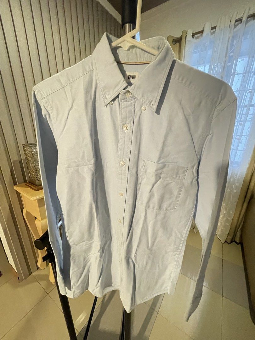 Uniqlo Light Blue Oxford Button Down Shirt (Category: Tshirts & Polo Shirts ) located in San Fernando. Submitted by shopauiesazon (Listing ID 1452703235, Image 3). Description: - Uniqlo Oxford Shirt - Color: Light Blue - Style: Button-down collar - Features: Chest pocket, Long sleeves - Versatile: Great for casual or smart casual outfits, easy to pair with anything. 📦 Shipping via J&T Express Shipping fee starts at ₱85-₱115 depending on location