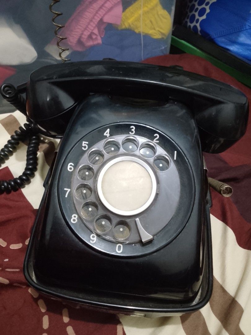 Vintage Black Rotary Dial Telephone with rotating base (Category: Vintage Collectibles) located in Manila. Submitted by herbertantazo (Listing ID 1452854364, Image 2). Description: sampaloc manila - Classic black rotary dial phone - Vintage piece with retro aesthetic - Handset connected by coiled cord - Rotary dial with numbers 0 -with rare rotating base - Ideal for collectors or unique decor - Visible signs of wear from Japan 2500.