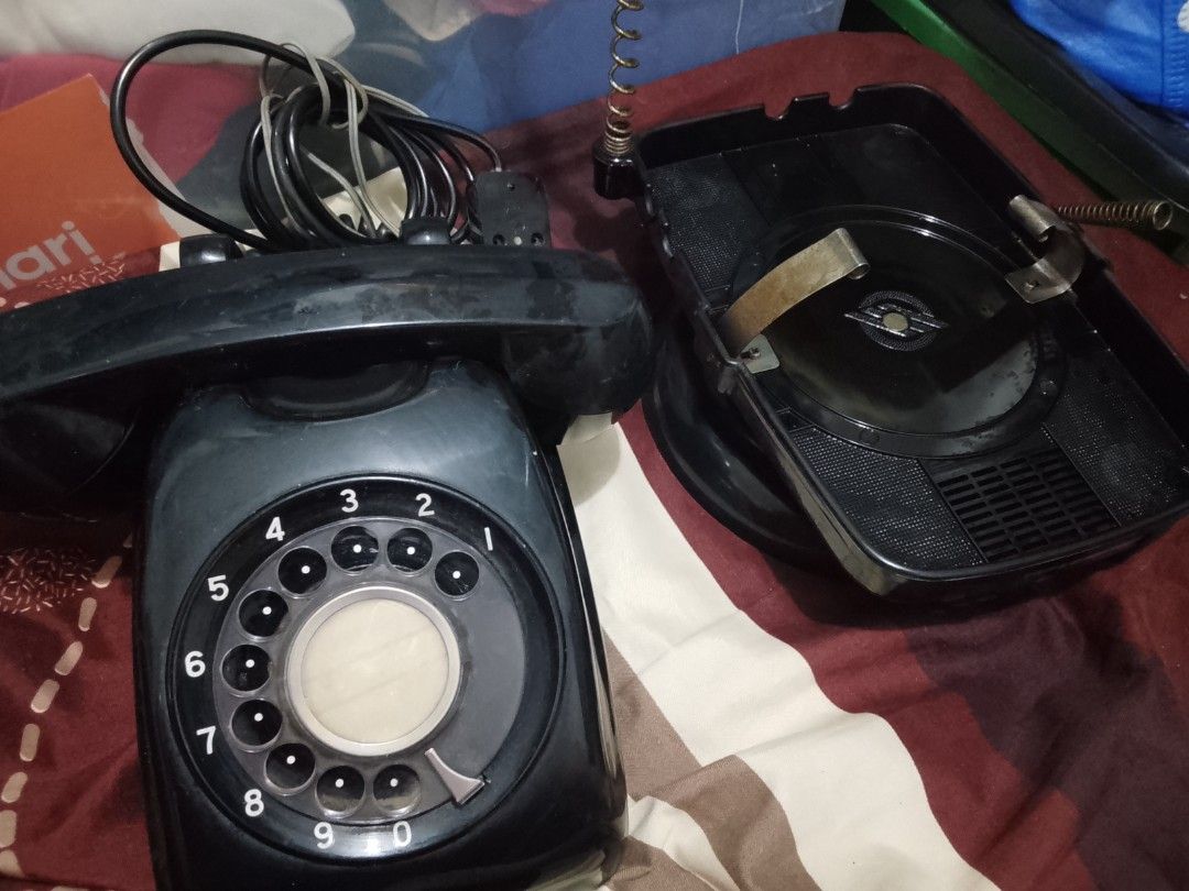 Vintage Black Rotary Dial Telephone with rotating base (Category: Vintage Collectibles) located in Manila. Submitted by herbertantazo (Listing ID 1452854364, Image 1). Description: sampaloc manila - Classic black rotary dial phone - Vintage piece with retro aesthetic - Handset connected by coiled cord - Rotary dial with numbers 0 -with rare rotating base - Ideal for collectors or unique decor - Visible signs of wear from Japan 2500.