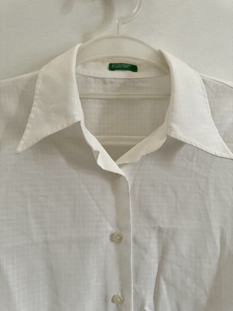 White Cropped Short Sleeve Button-Down Top (Category: Blouses) located in Marikina City. Submitted by hellolei_c (Listing ID 1452810690, Image 3). Description: Brand: United Colors of Benetton Color: White Style: Cropped / Boxy / Casual Polo / Lightweight / Minimalist Size: Medium Fabric/Texture: Lightweight, breathable, semi-sheer weave Sleeve Length: Short sleeves Features: Pointed collar, full front button closure.