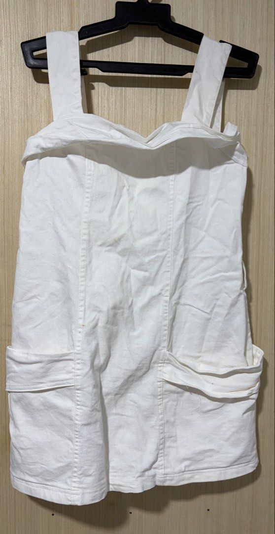 White Denim Pinafore Dress with Pockets (Category: Dresses) located in Pasay City. Submitted by a.daneee (Listing ID 1452835623, Image 1). Description: - Classic white denim pinafore dress - Two large front pockets - Adjustable straps for a perfect fit - Convenient back zipper closure - Simple and versatile style, great for layering.