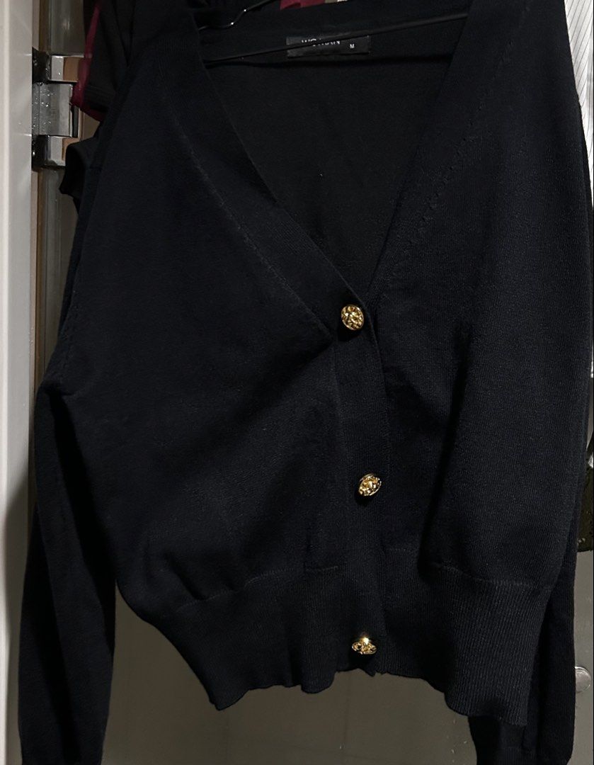 Woman Black Cardigan (Category: Others Tops) located in Manila. Submitted by 0844a636fcbbe31a73e1ff4334c7e3 (Listing ID 1452779881, Image 2). Description: PRICE NEGOTIABLE—JUST CLICK "MAKE OFFER"! 🪻 Looks better in person 🪻 Black Cardigan 🪻 Button details 🪻 Long sleeves 🪻 Unique design 🪻 Original Price: 999 🍀Location: Pasay Metro Manila 🍀Payment first policy (check shop reviews for legitimacy check🩵) 🪻Pay via GCash 🍀Product will only b