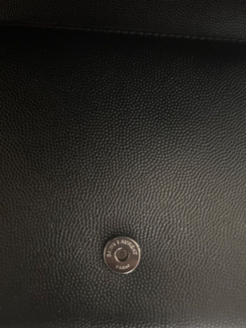 YSL black Grain Leather Wallet on Chain (WOC) (Category: Luxury Bags & Wallets) located in Makati City. Submitted by serene_simplicity (Listing ID 1452751920, Image 2). Description: Black on black. Timeless by design. The iconic YSL monogram meets textured leather and sleek black hardware for an effortlessly refined look. A bag that transitions seamlessly from day to night—minimal, elegant and unmistakably “Saint Laurant”—- (OG quality with dustb