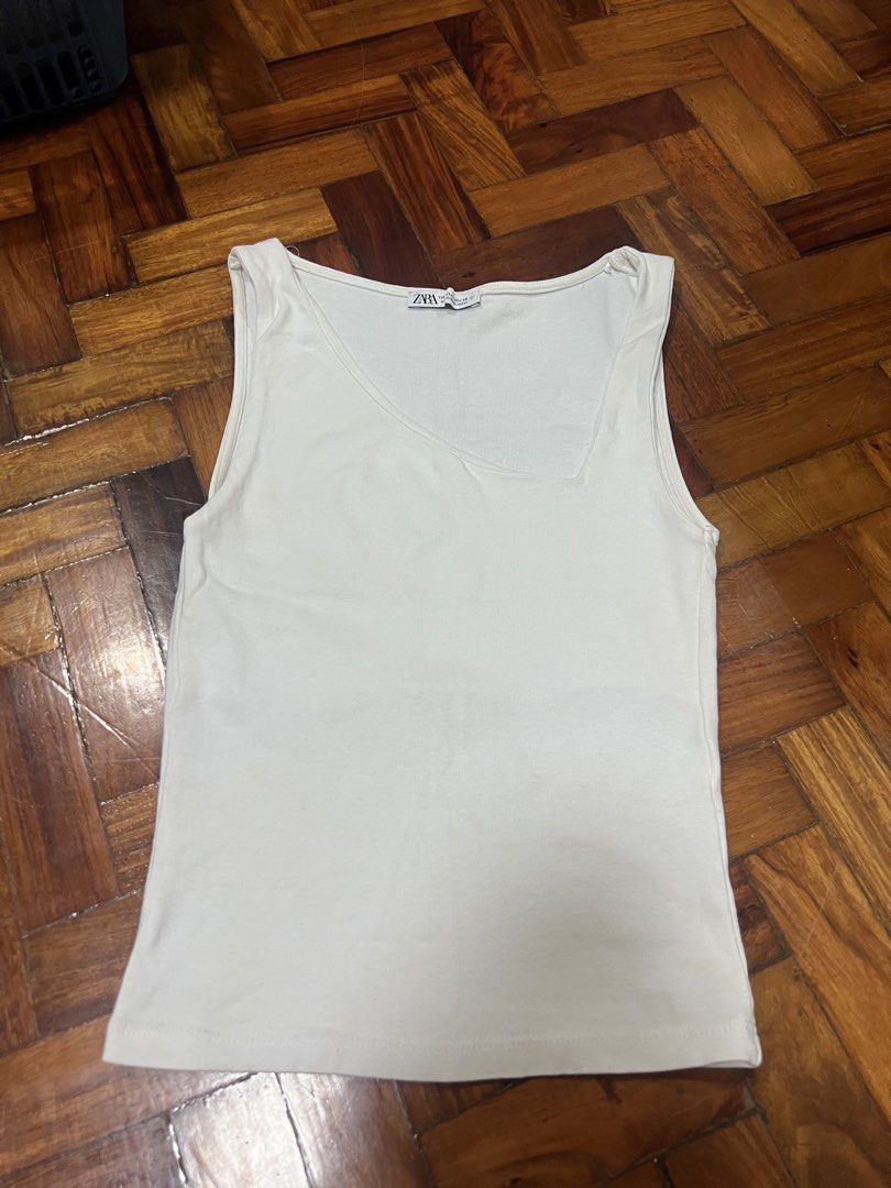 Zara White Asymmetrical Tank S-M (Category: Others Tops) located in Quezon City. Submitted by chloe_declutter (Listing ID 1452715757, Image 3). Description: Still available 07/26 Measurements posted in photo I also have this in red, size small Location (Pickup/Delivery) Cubao QC, near Gateway mall Code: Teal Box.