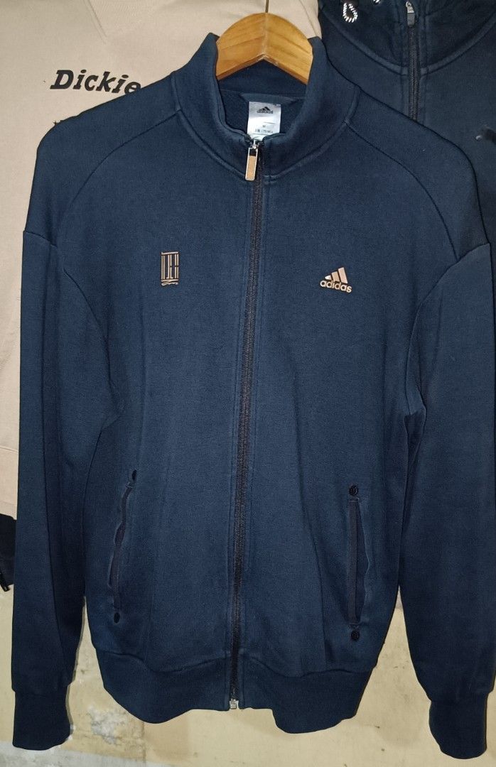 ADIDAS CONSLIVE SPORTS TRACK JACKET (Category: Coats, Jackets and Outerwear) located in Caloocan City. Submitted by ThriftMoYanEh (Listing ID 1452901381, Image 3). Description: ADIDAS CONSLIVE SPORTS TRACK JACKET EXCELLENT CONDITION SIZE: MEDIUM CAN FIT LARGE DIMENSION: 22x28 COLOR: DRK NAVY BLUE COLOR RATE: 9.6/10 NO FLAWS: NO ISSUE: PANG PORMA ASTIG PANGMOTOR ABOUT: - Navy blue Adidas track jacket - Features classic Adidas logo and tennis-theme