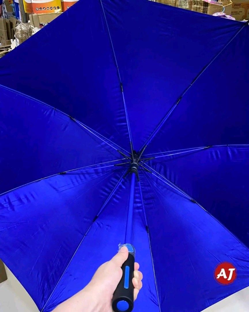AJ Golf Umbrella - Black & Blue (Category: Umbrellas) located in Manila. Submitted by marvieobordo (Listing ID 1452896446, Image 3). Description: - Large golf umbrella - Black exterior, vibrant sapphire blue interior - Sturdy and durable construction - Perfect for staying dry on the golf course or in the city - Includes a convenient shoulder strap for easy carrying - Available in multiple colors.