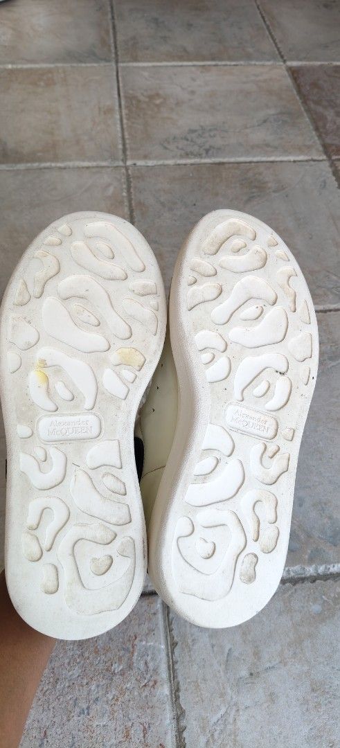 Alexander McQueen (Category: Sneakers) located in Singapore. Submitted by Cassie2407 (Listing ID 1452906818, Image 3). Description: - Brand: Alexander McQueen - Size: Women's EU36 - Color: White with black heel accents - Style: Classic low-top sneakers - Condition: Good pre-loved condition - Features: Iconic chunky sole, signature Alexander McQueen branding on sole and heel - Meetup only.
