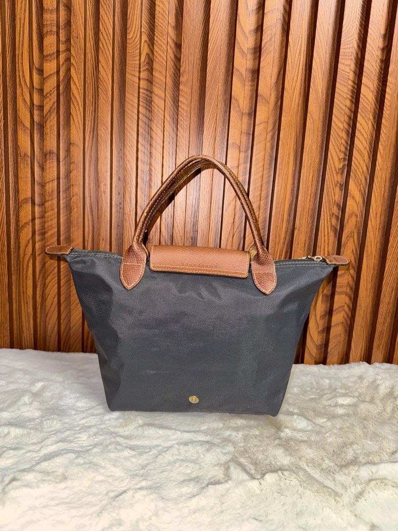 Authentic Longchamp Small Top Handle Bag (Category: Luxury Bags & Wallets) located in Subic. Submitted by luxshoppe88 (Listing ID 1452884806, Image 2). Description: - Stylish gray nylon and brown leather material top hndle tote bag - Durable nylon material - Spacious interior - Classic and versatile design mode of payment : bpi and gcash shipping will be done once payment confirm.. or the next day. HAPPY SHOPPING!! T-H-A-N-K Y-O-U! 😊 .