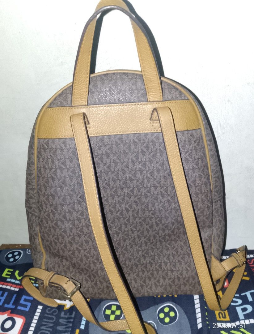 Authentic michael kors MK backpack preloved (Category: Luxury Bags & Wallets) located in Manila. Submitted by candy34_90 (Listing ID 1449885361, Image 1). Description: bag only, wlang sira. large size badly need funds dasma area.
