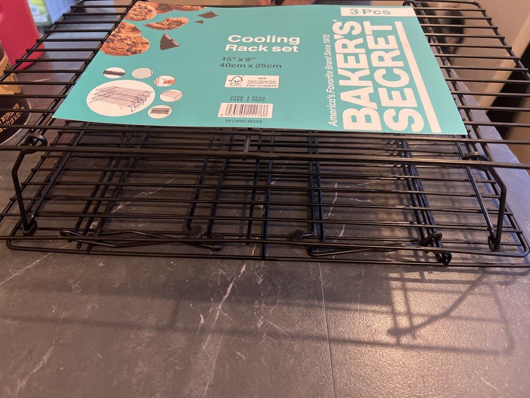Baker's Secret 3 Pcs Cooling Rack Set 15"x9" (Category: Storage Boxes & Baskets) located in Cebu City. Submitted by zershrovv (Listing ID 1452968398, Image 2). Description: - Set of 3 Baker's Secret cooling racks - Each rack measures 15" x 9" (40cm x 25cm) - PTFE, PFOA, and BPA free materials - Ideal for cooling cakes, cookies, and other baked treats.