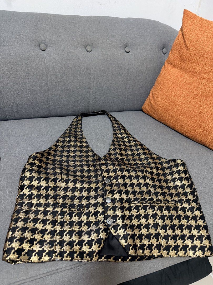 Black and Gold Houndstooth Halter Vest (Category: Vests) located in Mandaluyong City. Submitted by 7thstudiobyk (Listing ID 1453034301, Image 1). Description: - Stylish black and gold houndstooth halter vest - Features front button closure - Includes a convenient pocket detail - Versatile piece: wear layered or on its own - A unique addition to any wardrobe.