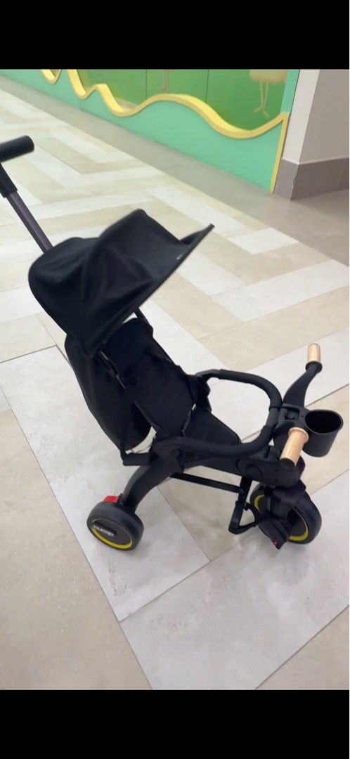 Black Doona Liki Trike S5 (Category: Strollers) located in Muntinlupa City. Submitted by emcrys (Listing ID 1453003661, Image 1). Description: - Doona Liki Trike s5 in Black - Ideal for toddlers - Easy to maneuver and fold - Features a cup holder - Includes a sun canopy - Smooth-riding wheels - Ready for adventures! Buy for 1600 sar 25k in pesos For sale 14k nego! May tags pa.