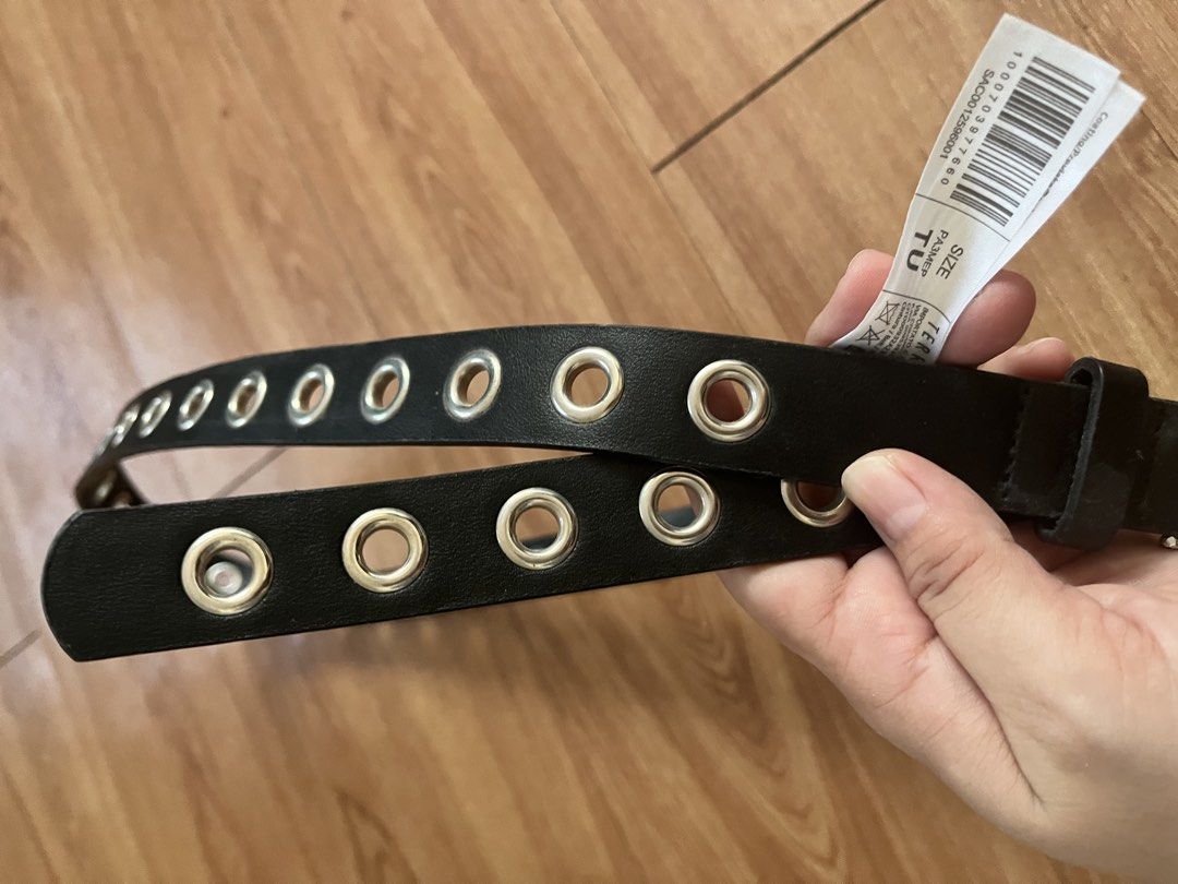 Black Eyelet Belt with Silver Buckle (Category: Belts) located in San Pablo. Submitted by celgvr (Listing ID 1453048114, Image 2). Description: - Black belt with silver eyelets all around - Features a silver buckle - Tag indicates size TU - A versatile accessory to elevate any outfit.