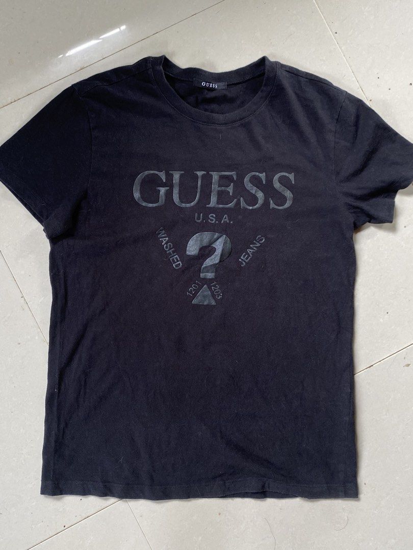 Black Guess USA T-shirt (Category: Tshirts & Polo Shirts ) located in Cabadbaran. Submitted by jersey.cobyming (Listing ID 1452916420, Image 1). Description: - Brand: Guess USA - Color: Black - Logo: Classic question mark logo - Material: Cotton - Origin: Made in Korea - Size: Medium (M) - Style: Casual wear Dimes: L: 26.5" W: 20".