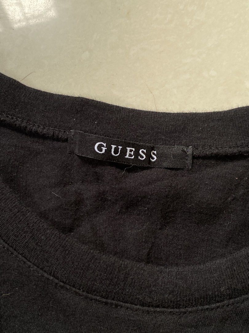 Black Guess USA T-shirt (Category: Tshirts & Polo Shirts ) located in Cabadbaran. Submitted by jersey.cobyming (Listing ID 1452916420, Image 2). Description: - Brand: Guess USA - Color: Black - Logo: Classic question mark logo - Material: Cotton - Origin: Made in Korea - Size: Medium (M) - Style: Casual wear Dimes: L: 26.5" W: 20".