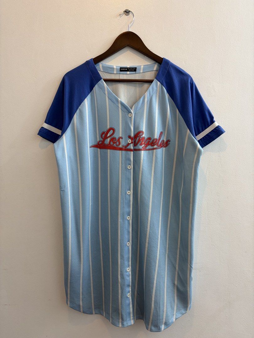 Blue Baseball Shirt Los Angeles Full Button (Category: Activewear) located in Paranaque City. Submitted by stfunasherramirez (Listing ID 1452930809, Image 1). Description: Size: L on tag Dimes: L34 W23 Condition: 9/10 Color rate: 9/10 - excellent fabric - excellent condition - comfy fabric - text design logo - baseball shirt Issue: - stains. (See images).