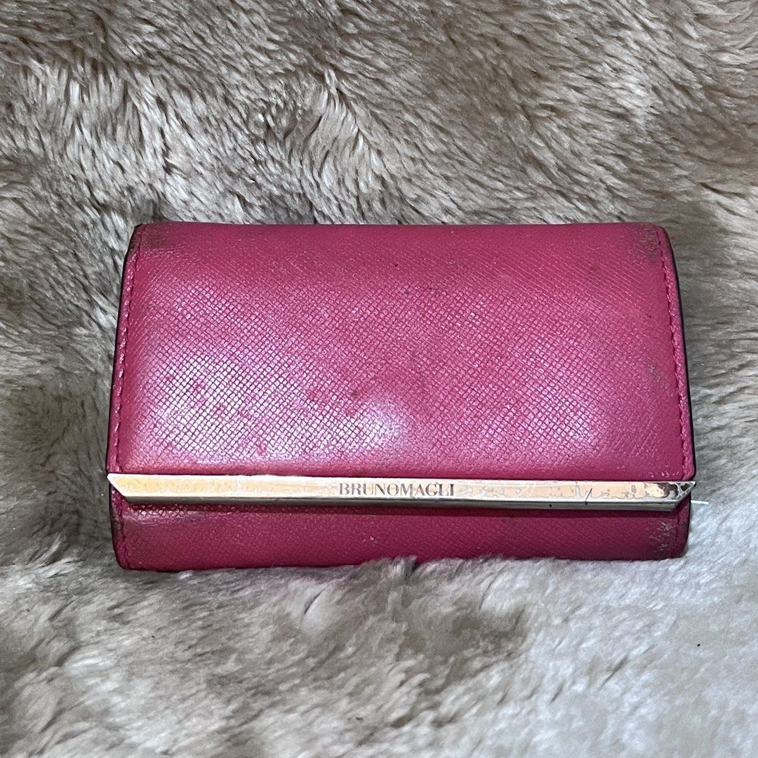 BRUNOMAGLI Pink Leather Key Holder Wallet (Category: Wallets & Card holders) located in Cabadbaran. Submitted by dfgthriftology (Listing ID 1452912015, Image 1). Description: - Genuine Pink Leather Key Holder by BRUNOMAGLI - Interior features 4 key hooks - Includes a detachable keyring with a small tag.