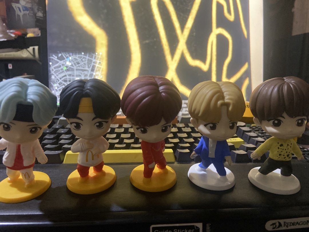 BTS Chibi Figurines Set (take all) (Category: Figurines & Statues) located in Taguig. Submitted by billpogi23 (Listing ID 1452913635, Image 1). Description: - Set of 5 adorable BTS chibi figurines - Each figurine features a unique outfit - Includes one BTS member in a McDonald's uniform - Figures stand on individual yellow or white bases - Ideal for any BTS fan's collection - Perfect for displaying on desks or shelves.