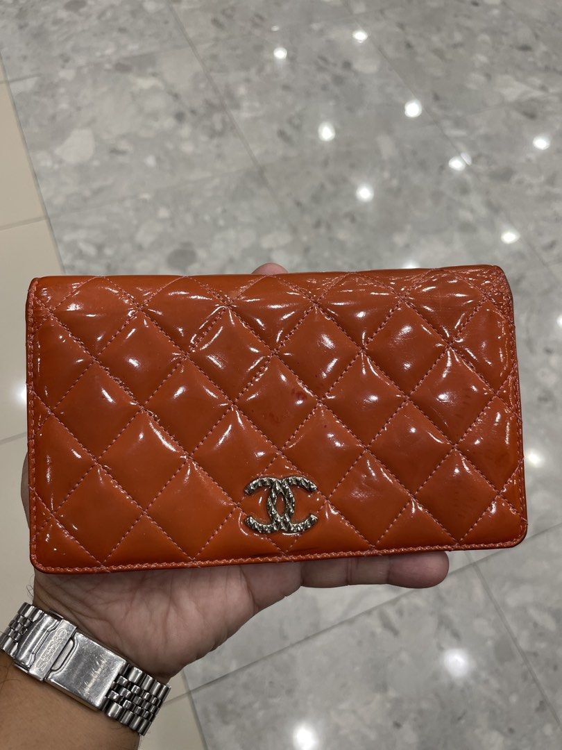 Chanel Quilted Long Flap Wallet (Category: Luxury Bags & Wallets) located in Calapan. Submitted by lucasthrifts (Listing ID 1452911737, Image 1). Description: -Authentic Chanel Quilted long flap wallet (orange) -With sign of usage -Lampo under zip -15500 add sf .
