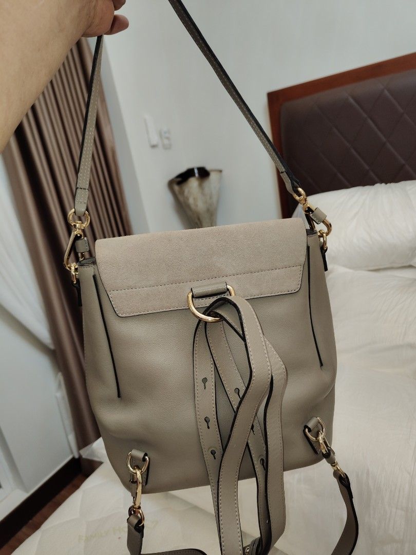 Chloe Faye Backpack Grey Leather Suede (Category: Luxury Bags & Wallets) located in Pasay City. Submitted by janiell (Listing ID 1453045873, Image 2). Description: - Authentic Chloe Faye backpack in a stylish grey color. - Made from a luxurious combination of leather and suede. - Features the iconic Chloe ring and chain detail. - Adjustable straps for comfortable wear. - Convenient side zippers for easy access. - Interior lined with durable fabri