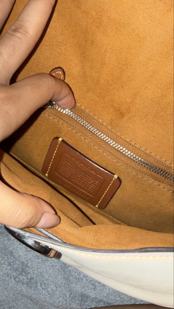 Coach Cream Leather Shoulder Bag with Detachable Strap (Category: Luxury Bags & Wallets) located in Manila. Submitted by kaletzclozet (Listing ID 1452882315, Image 3). Description: Cream leather shoulder bag from Coach. Comes with a detachable strap for versatility. The interior is lined with a tan suede-like material and has a zip pocket. Hardware is silver-toned. Includes the original dust bag. Great for everyday use or special occasions..