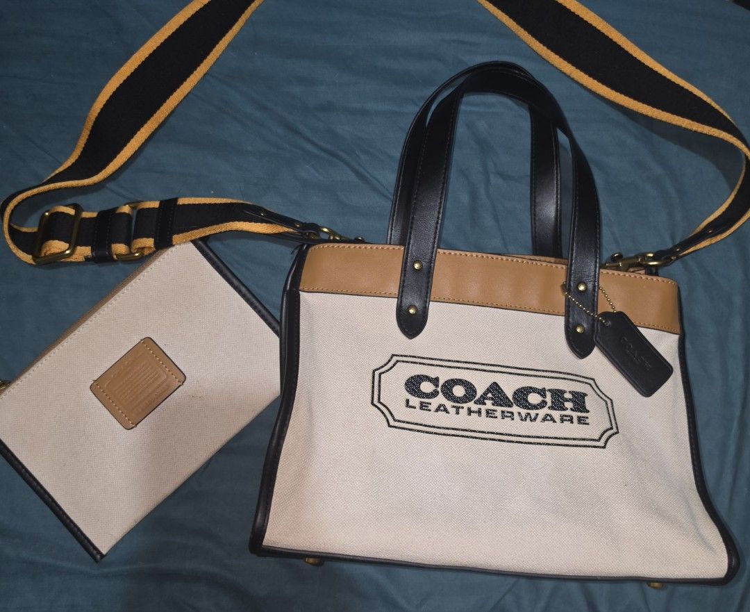 Coach Field tote 30cm canvas (Category: Luxury Bags & Wallets) located in Quezon City. Submitted by preloveditems.qc (Listing ID 1452926883, Image 1). Description: - Authentic Coach tote bag -9.5/10 Condition - Durable canvas and tan leather construction - Stylish black and yellow striped strap - Includes a matching canvas pouch - Interior zippered pocket for secure storage - Elegant gold hardware details - Ideal for everyday errands and activiti