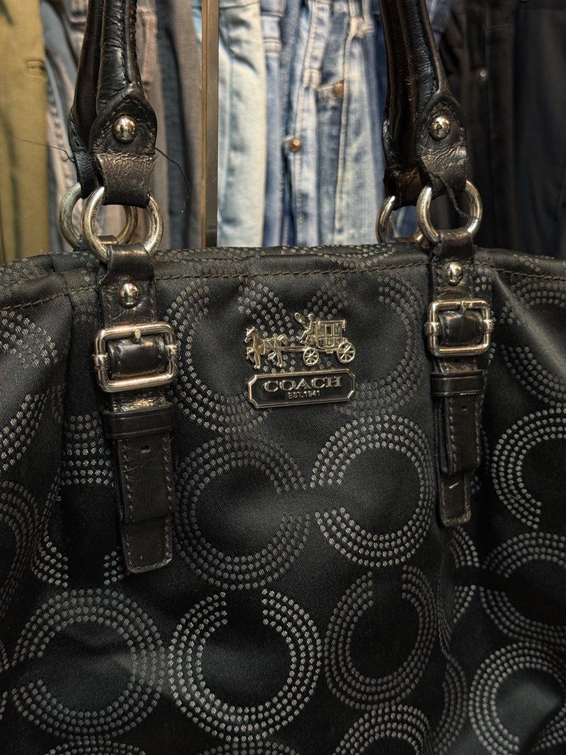Coach Signature C Pattern Tote Bag Black (Category: Luxury Bags & Wallets) located in Legazpi City. Submitted by deadthrift (Listing ID 1453003858, Image 2). Description: - black Coach tote bag - Signature 'C' pattern - Genuine leather handles - Silver-tone hardware - Interior zippered pocket - Minor marks on interior lining - Ideal for everyday carry.