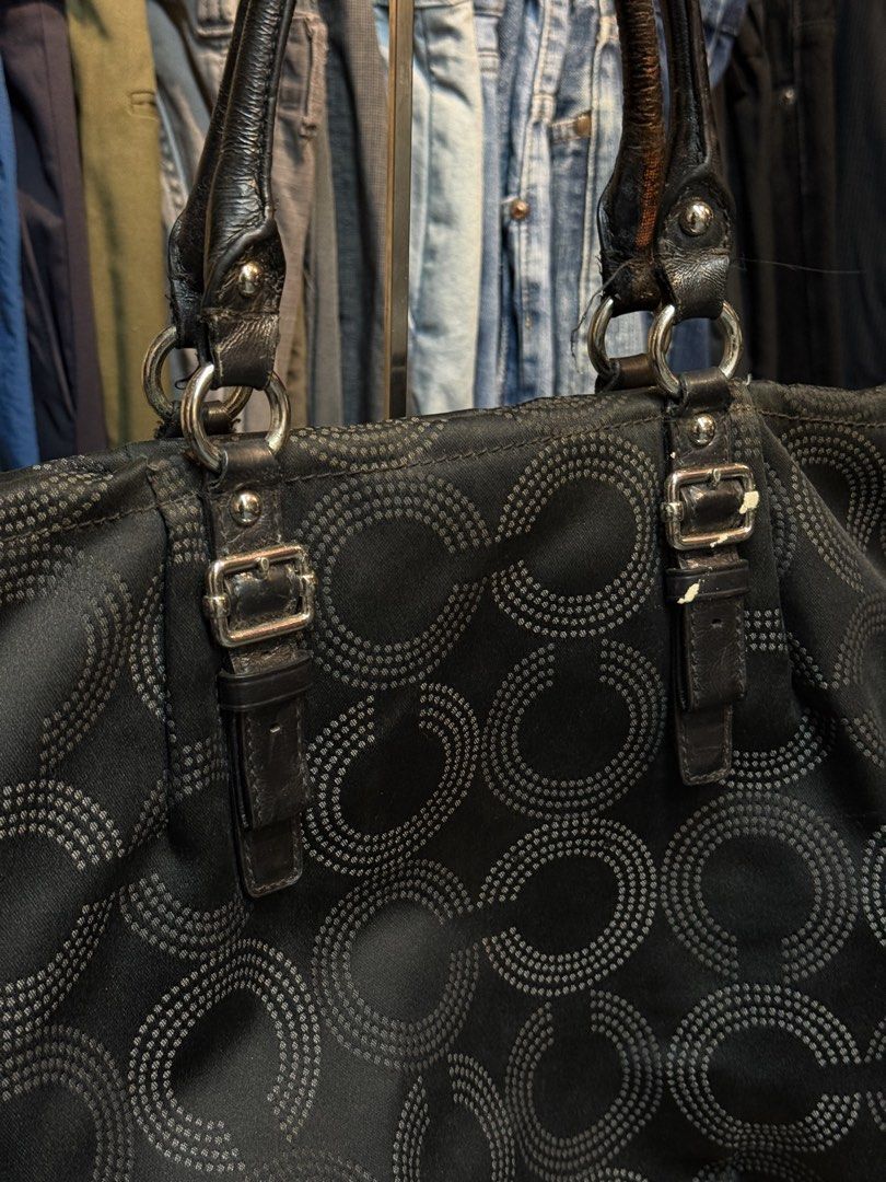 Coach Signature C Pattern Tote Bag Black (Category: Luxury Bags & Wallets) located in Legazpi City. Submitted by deadthrift (Listing ID 1453003858, Image 3). Description: - black Coach tote bag - Signature 'C' pattern - Genuine leather handles - Silver-tone hardware - Interior zippered pocket - Minor marks on interior lining - Ideal for everyday carry.