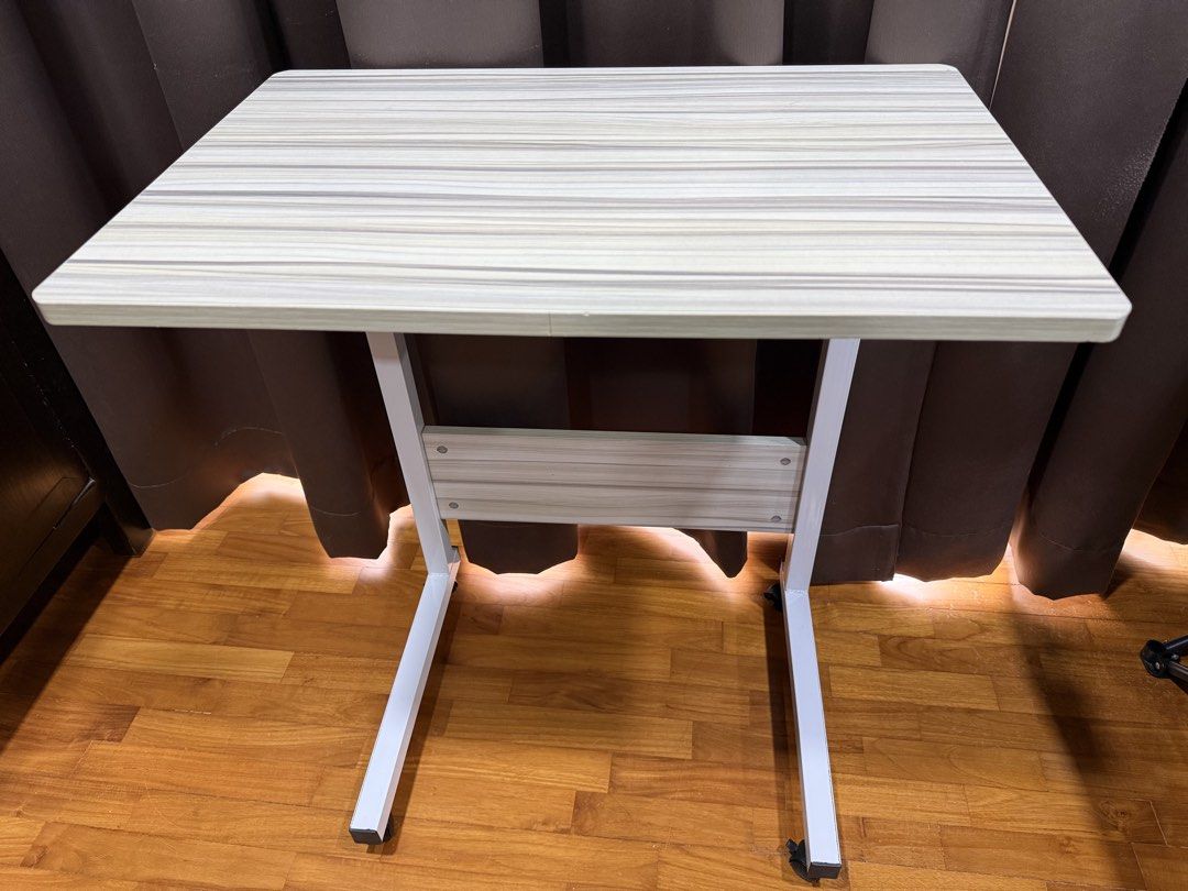 Computer desk (Category: Tables & Sets) located in Singapore. Submitted by ultimatemachine (Listing ID 1452890177, Image 1). Description: * Durable and strong * Can be dismantled to smaller parts for transport * White in color * 60 x 40cm table top * Height 70-90 cm adjustable. wheel + bottom stand height 7cm.