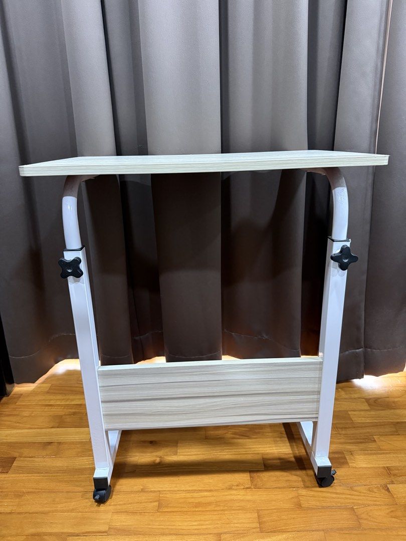 Computer desk (Category: Tables & Sets) located in Singapore. Submitted by ultimatemachine (Listing ID 1452890177, Image 3). Description: * Durable and strong * Can be dismantled to smaller parts for transport * White in color * 60 x 40cm table top * Height 70-90 cm adjustable. wheel + bottom stand height 7cm.