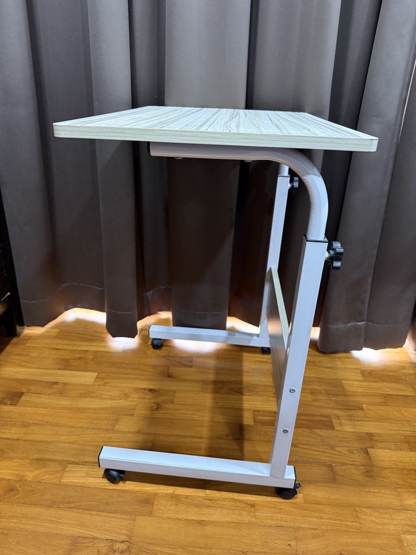 Computer desk (Category: Tables & Sets) located in Singapore. Submitted by ultimatemachine (Listing ID 1452890177, Image 2). Description: * Durable and strong * Can be dismantled to smaller parts for transport * White in color * 60 x 40cm table top * Height 70-90 cm adjustable. wheel + bottom stand height 7cm.