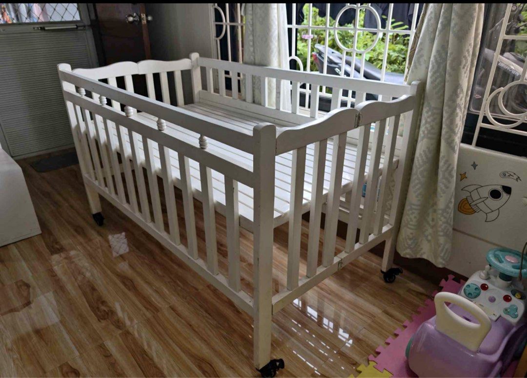 Customized wooden crib for twins (Category: Cots & Cribs) located in Lucena. Submitted by theangelou94395 (Listing ID 1453046163, Image 1). Description: Customized Crib For Twins - adjustable, foldable, dropside with wheels - 28 x 52 size ng inside crib - 31 x 55 size outside crib - With free bumper and beddings (comforter) No mattress included Can do meet up/deliver if around lucena city. Original price: Crib plus wheels: 5500 Beddings (comforte