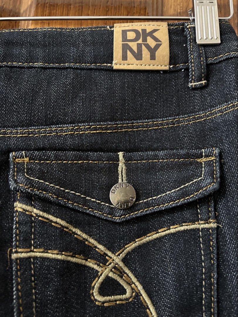 DKNY Dark Wash Denim Jeans Size 14 (Category: Jeans) located in Paranaque City. Submitted by allthatclutterph (Listing ID 1452905154, Image 3). Description: - Brand: DKNY - Color: Dark Wash Denim - Fit: Straight Leg - Closure: Button and Zip Fly - Special Features: Back pockets with button closure and decorative stitching - Origin: Made in China - Size: 14.