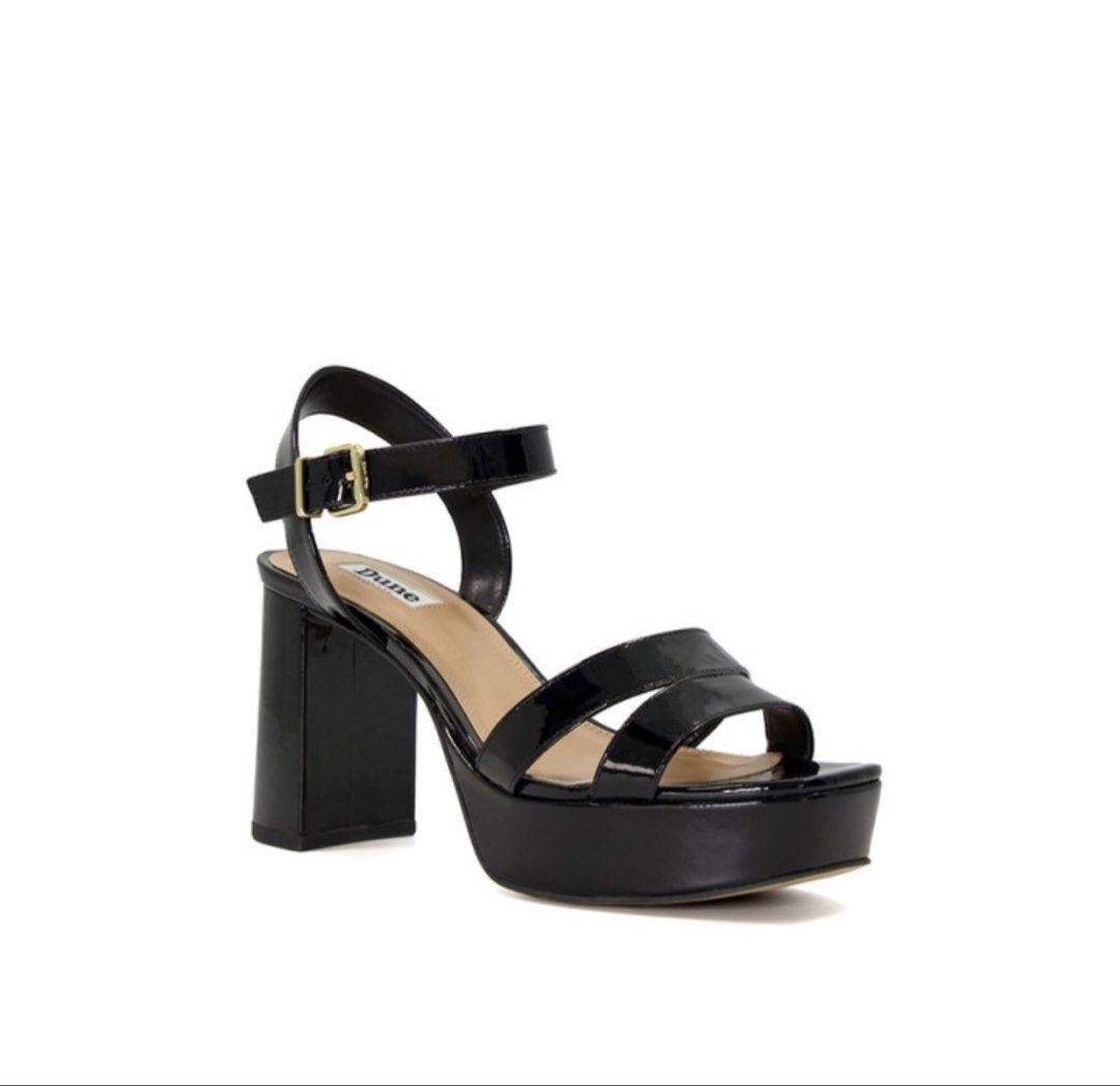 Dune London Black Patent Platform Block Heel Sandals (Category: Heels) located in Makati City. Submitted by g.ang.s (Listing ID 1452936637, Image 2). Description: - Brand: Dune London - Color: Black Patent - Style: Platform Sandals - Heel: Chunky Block Heel - Closure: Ankle strap with buckle - Design: Strappy front - Features: Comfortable platform sole - Versatility: Perfect for dressing up or down.