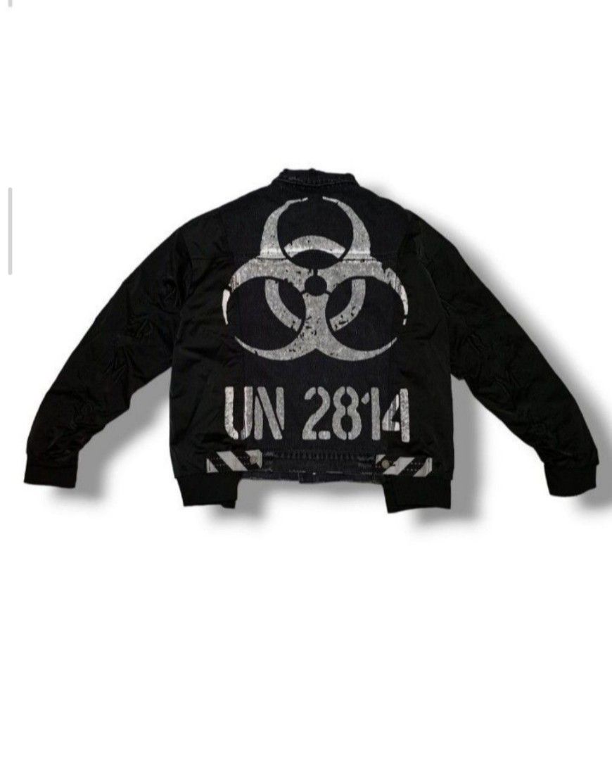 DX Black Bomber Jacket (Category: Coats, Jackets and Outerwear) located in General Trias. Submitted by dunht (Listing ID 1452941729, Image 3). Description: - Black bomber jacket - Distressed denim front panels - Nylon sleeves and back - Biohazard symbol and 'UN 2814' graphic on back - Zipper pocket on sleeve - Tagged 'DX'.