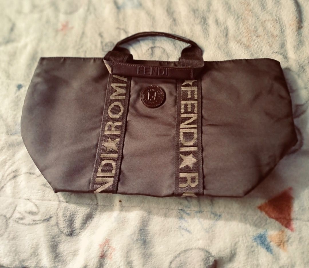 Fendi Roma Monogram Canvas Mini Boston Bag (Category: Luxury Bags & Wallets) located in Pila. Submitted by ester_aurea (Listing ID 1452911633, Image 1). Description: Vintage Fendi Bag Authenticity not guarantee Please check Preloved and well kept Minor issue sa leather chips sa loob No issue sa color materials sa labas , mahirap lang xa kunan tru cp kc nag iiba kulay nya sa photo . NO DISCOLORATION po yan sa actual , pantay po kulay nya sa person