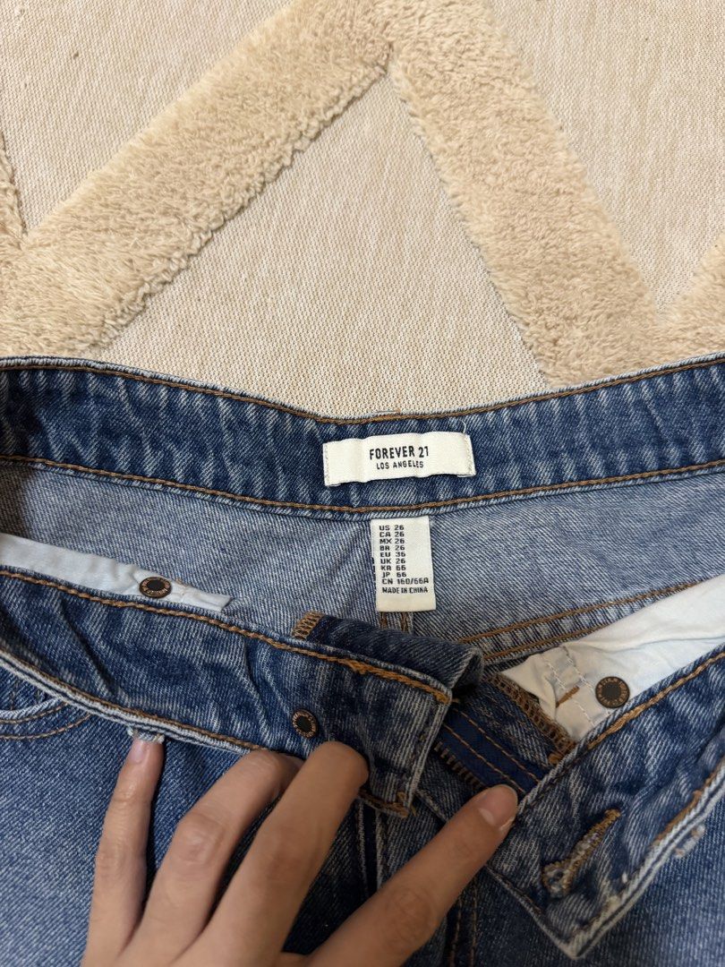 Forever 21 Blue Denim High-Waisted Shorts (Category: Shorts) located in Bacoor. Submitted by conclaseph (Listing ID 1452892864, Image 2). Description: - Classic blue denim shorts from Forever 21 - High-waisted style - Cuffed hem - Two front and two back pockets - Button and zip closure - Ideal for casual wear and easy to style.