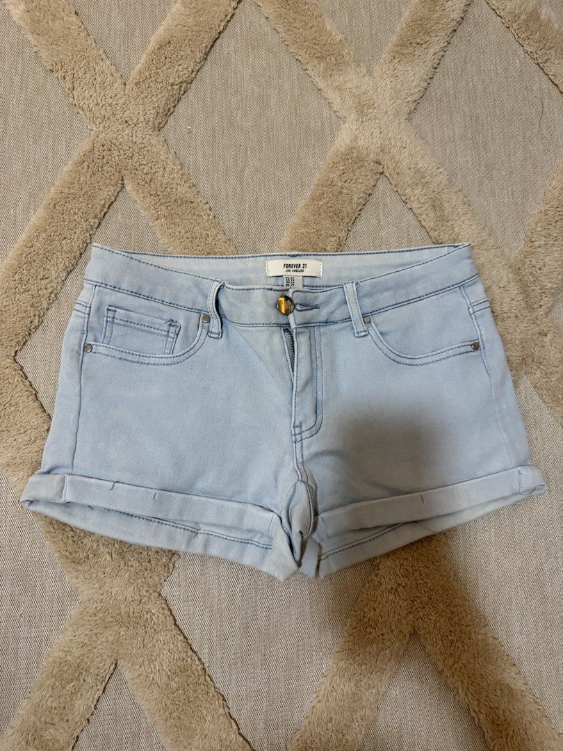 Forever 21 Light Wash Denim Cuffed Shorts (Category: Shorts) located in Bacoor. Submitted by conclaseph (Listing ID 1452893464, Image 1). Description: - Light wash denim shorts - Brand: Forever 21 - Classic five-pocket design - Zip fly with button closure - Cuffed hem - Ideal for casual wear - Versatile: pairs easily with any top.