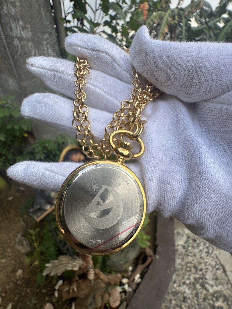 Gold Tone Constellation Pocket Watch with Chain (Category: Women's Watches) located in Cainta. Submitted by danica010314 (Listing ID 1452913490, Image 3). Description: - Unique starry night dial with constellations - Includes a gold-tone chain - Back markings: 'Japan Movt' and 'Stainless' - Stylish accessory for any outfit.