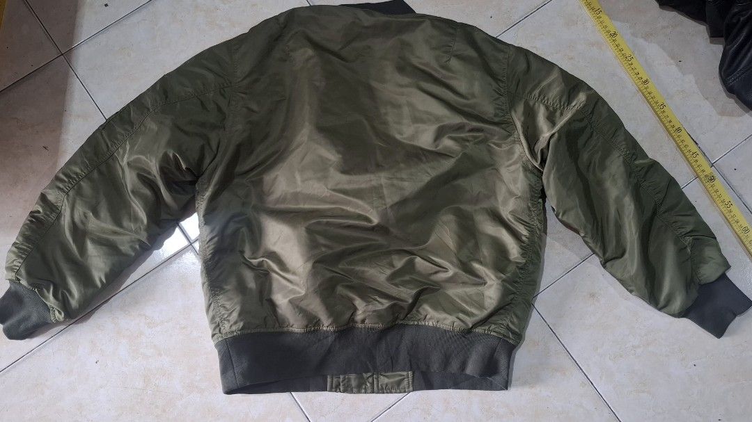Gu bomber (Category: Coats, Jackets and Outerwear) located in Baguio. Submitted by thriftrot (Listing ID 1452880735, Image 2). Description: g.u. bomber in very good condition no issue size and dimes on photos loc. baguio add shipping fee 780 pesos.