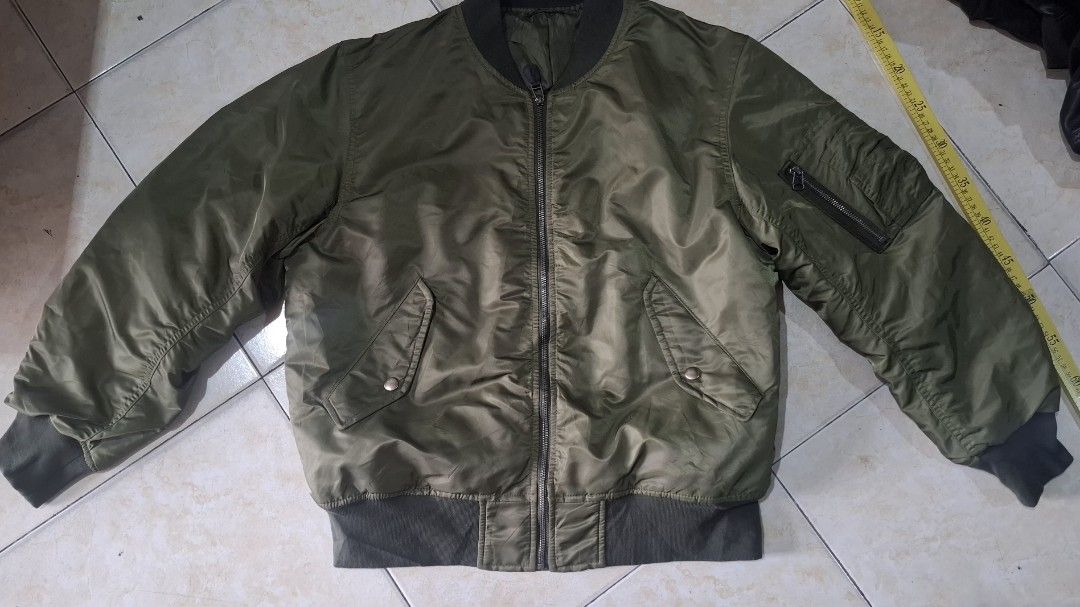 Gu bomber (Category: Coats, Jackets and Outerwear) located in Baguio. Submitted by thriftrot (Listing ID 1452880735, Image 1). Description: g.u. bomber in very good condition no issue size and dimes on photos loc. baguio add shipping fee 780 pesos.