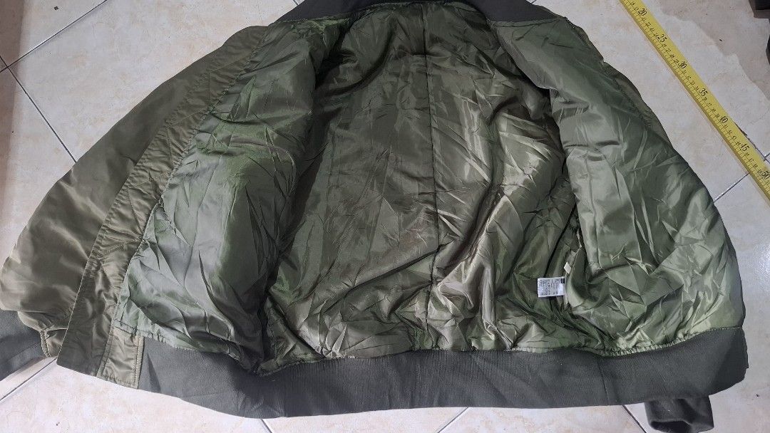 Gu bomber (Category: Coats, Jackets and Outerwear) located in Baguio. Submitted by thriftrot (Listing ID 1452880735, Image 3). Description: g.u. bomber in very good condition no issue size and dimes on photos loc. baguio add shipping fee 780 pesos.