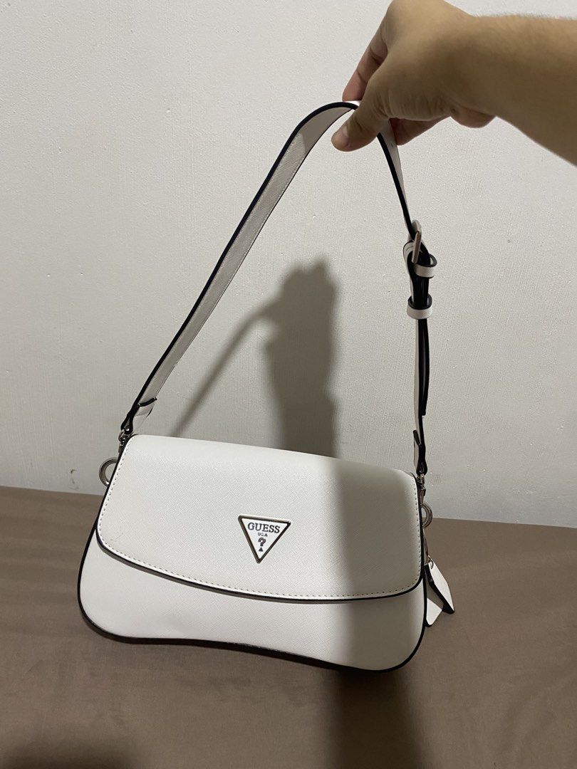 Guess shoulder bag in white (Category: Shoulder Bags) located in Cotabato. Submitted by inombeer (Listing ID 1453019617, Image 1). Description: 💕Good as new 💕 Used for 2 times (i like black more) 💕 Bought in KCC Guess physical store 💕Comes with long and short strap 💕 Bought for 5300 at Guess KCC 💕 RUSH SALE. NEED FUNDS.