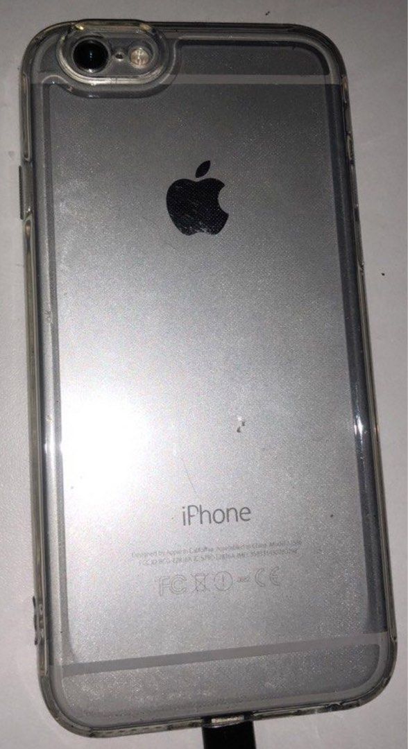 Iphone 6 camera has black spots (Category: iPhone 6 Series) located in Taguig. Submitted by hanniedew (Listing ID 1452999639, Image 2). Description: - iPhone 6 (Silver, 64GB) - Includes clear protective case - Camera has visible black spots - Screen shows minor scratches - Overall functional condition 🍄may black spots ang camera sa likod,pwede papalitan(mura lang ang replacement ng camera) 🍄may small chip sa baba,kapag nalagyan ng protector hin