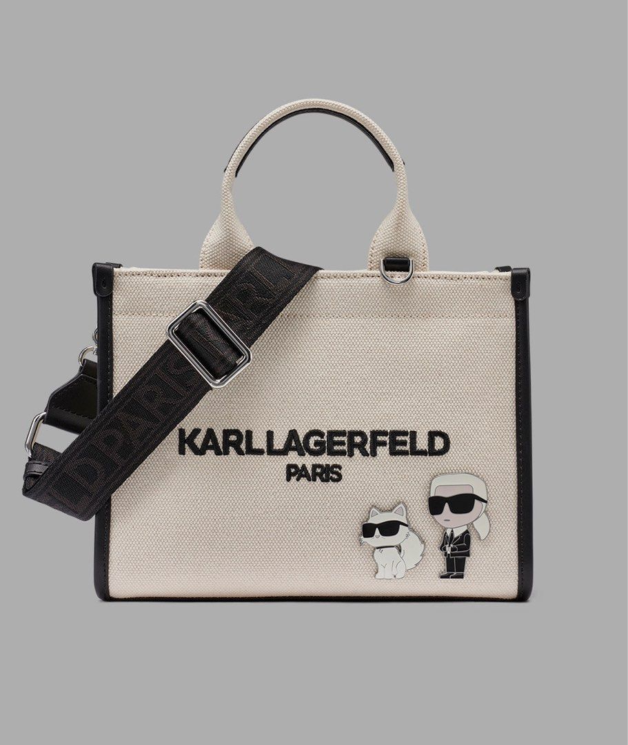 Karl Lagerfeld Kristina (Category: Tote Bags) located in Las Pinas. Submitted by mailoooooveszx (Listing ID 1452994180, Image 1). Description: - Cute Karl Lagerfeld tote bag - Cream canvas with black trim - Features Karl Lagerfeld Paris logo - Includes two adorable Karl charms - Top handles - Detachable shoulder strap - Interior patterned lining - Interior zip pocket - Great for everyday use.