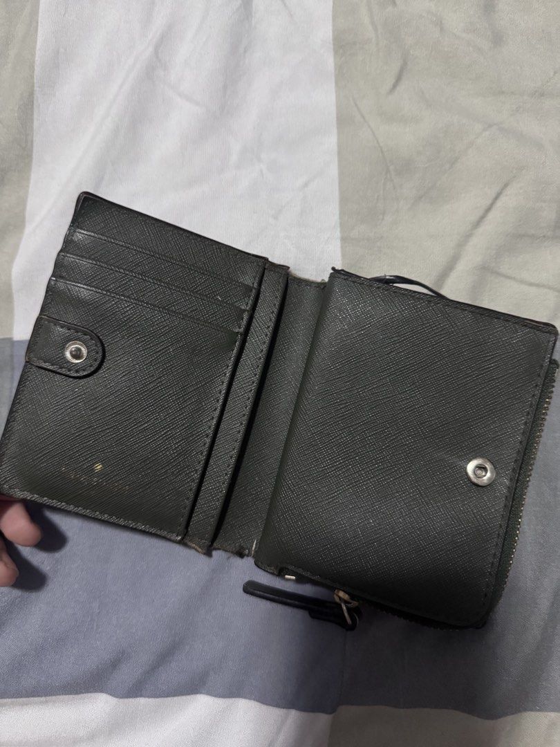 Kate Spade Trifold Olive Green Wallet (Category: Wallets & Card holders) located in Tarlac. Submitted by mystelriousclutt3rs (Listing ID 1452931337, Image 3). Description: issues (pls see photos for issues): - heavy corner wear - peeling along the fold/hinge - scratches this is an authentic kate spade wallet. bought in hk, no receipt since it’s an old wallet mod: j&t mop: gcash no return and refund.