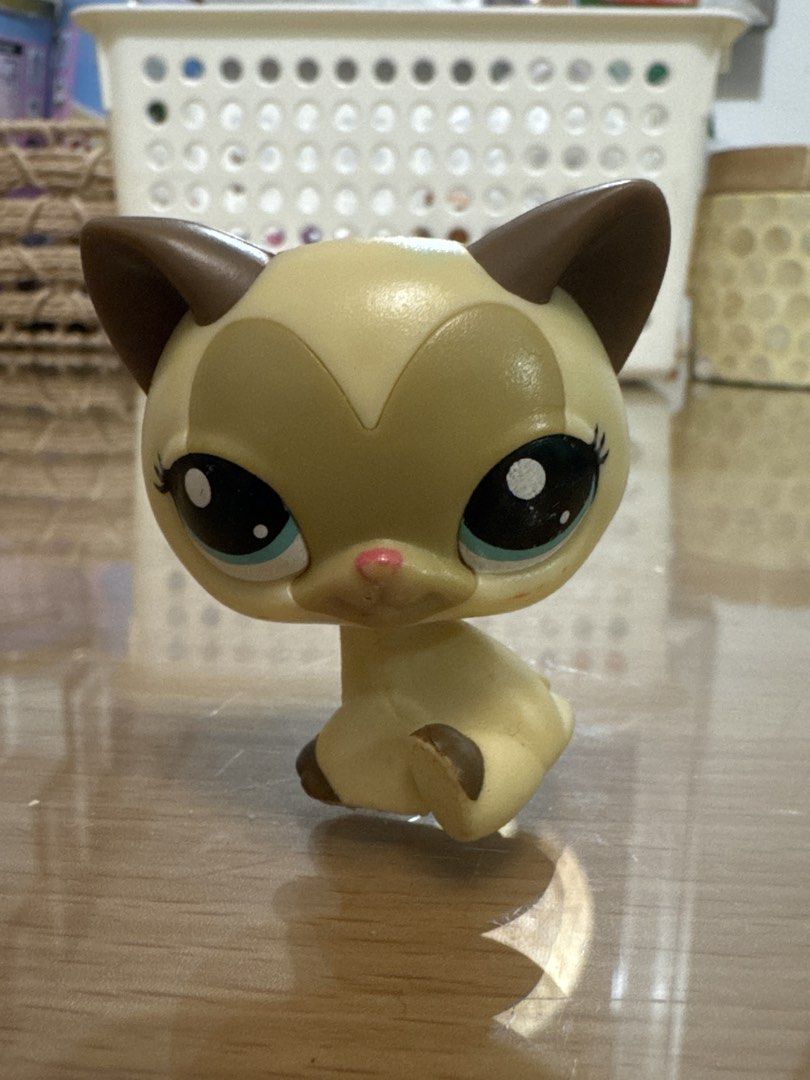 Littlest Pet Shop Siamese Cat Toy (Category: Kids Toys) located in Pasig City. Submitted by acffashion31 (Listing ID 1452960814, Image 1). Description: - Adorable LPS Siamese cat toy - Features big blue eyes and brown ears - Sits in a cute, collectible pose - Ideal addition for any LPS collector - Ready for a new loving home.