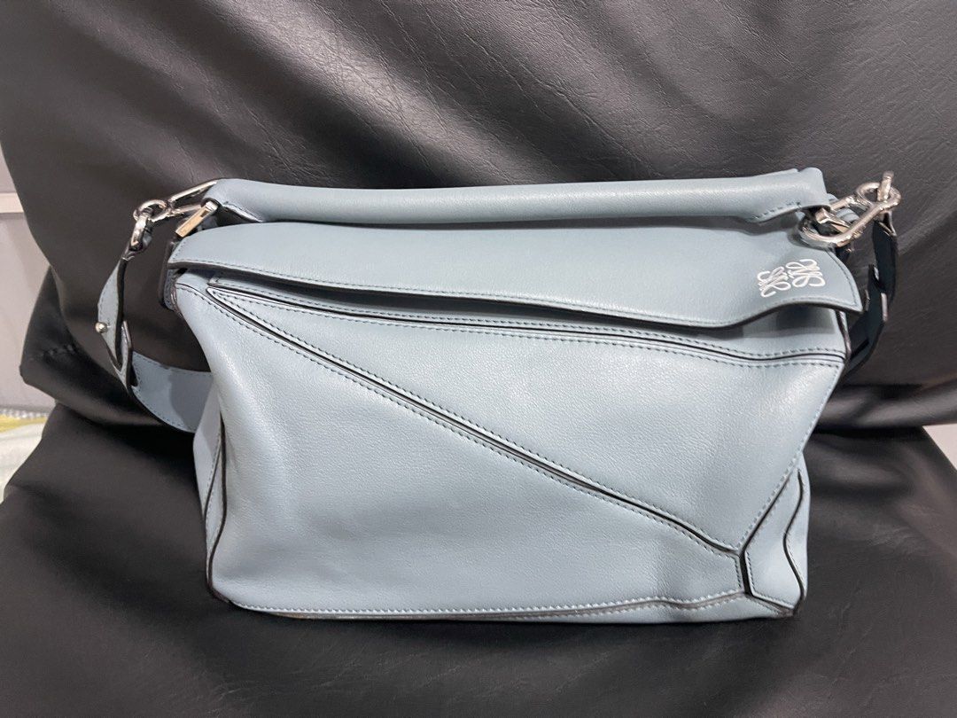 Loewe Hammock Bag Light Blue Leather (Category: Luxury Bags & Wallets) located in Lupao. Submitted by jennylynda42204 (Listing ID 1448621311, Image 3). Description: - Loewe Hammock Bag - Color: Light Blue - Material: Soft Leather - Interior: Herringbone lining with a small pocket - Closure: Zipper - Hardware: Silver-toned - Ideal for: Everyday use.